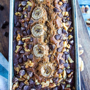 Banana Bread with Chocolate Chips and Walnuts is a super moist and tender quick bread perfect for using up ripe bananas. Great as a snack, dessert or breakfast with your morning coffee!