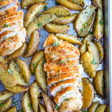 Easy Garlic Herb Chicken with Potatoes is deliciously herb spiced chicken breasts with crispy potato wedges made simple on a single sheet pan.