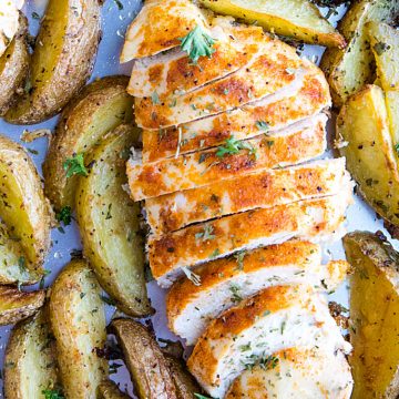 Easy Garlic Herb Chicken with Potatoes is deliciously herb spiced chicken breasts with crispy potato wedges made simple on a single sheet pan. #mustlovehomecooking #chickendinner #sheetpandinner #sheetpanchicken