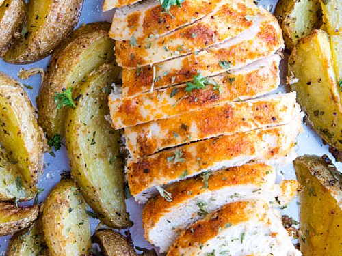 Easy Garlic Herb Chicken with Potatoes is deliciously herb spiced chicken breasts with crispy potato wedges made simple on a single sheet pan. #mustlovehomecooking #chickendinner #sheetpandinner #sheetpanchicken