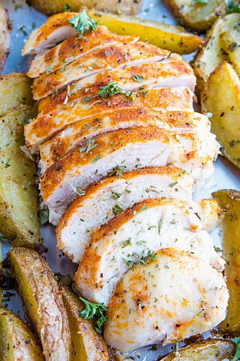 Easy Garlic Herb Chicken with Potatoes is deliciously herb spiced chicken breasts with crispy potato wedges made simple on a single sheet pan. Great for weeknight supper #mustlovehome #chickendinner #sheetpandinner